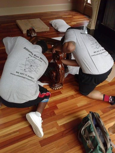 Skilledd movers are assembling furniture with care